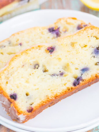 This Lemon Blueberry Bread is perfectly sweet, moist, and simple to make. An easy lemon glaze adds a touch of sweetness that makes this bread perfect for breakfast or dessert!
