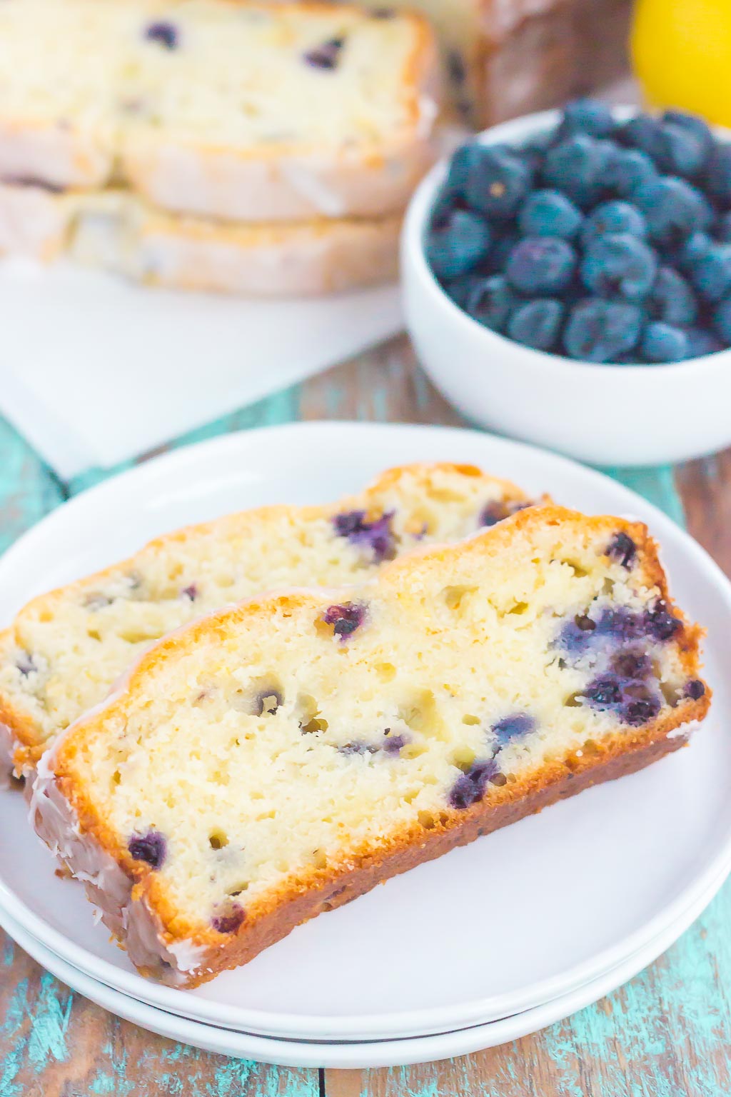 This Lemon Blueberry Bread is perfectly sweet, moist, and simple to make. An easy lemon glaze adds a touch of sweetness that makes this bread perfect for breakfast or dessert!