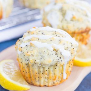 These Lemon Poppy Seed Muffins are soft, fluffy and bursting with flavor. Drizzled with an easy cream cheese glaze, these muffins are perfect for a simple breakfast or dessert!