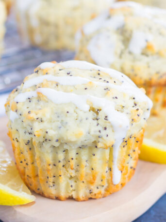 These Lemon Poppy Seed Muffins are soft, fluffy and bursting with flavor. Drizzled with an easy cream cheese glaze, these muffins are perfect for a simple breakfast or dessert!