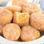 These Baked Cinnamon Sugar Donut Holes are soft, fluffy, and easy to make. Sweet cinnamon and sugar gives this simple baked donut the perfect touch of flavor. Perfect to serve for breakfast or dessert!