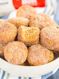 These Baked Cinnamon Sugar Donut Holes are soft, fluffy, and easy to make. Sweet cinnamon and sugar gives this simple baked donut the perfect touch of flavor. Perfect to serve for breakfast or dessert!