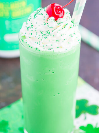 Skip the drive-thru and make your own Copycat Shamrock Shake. Sweet vanilla ice cream and a touch of mint are blended together until smooth and creamy. Topped with whipped cream and a cherry, you'll be making this minty shake all year long!