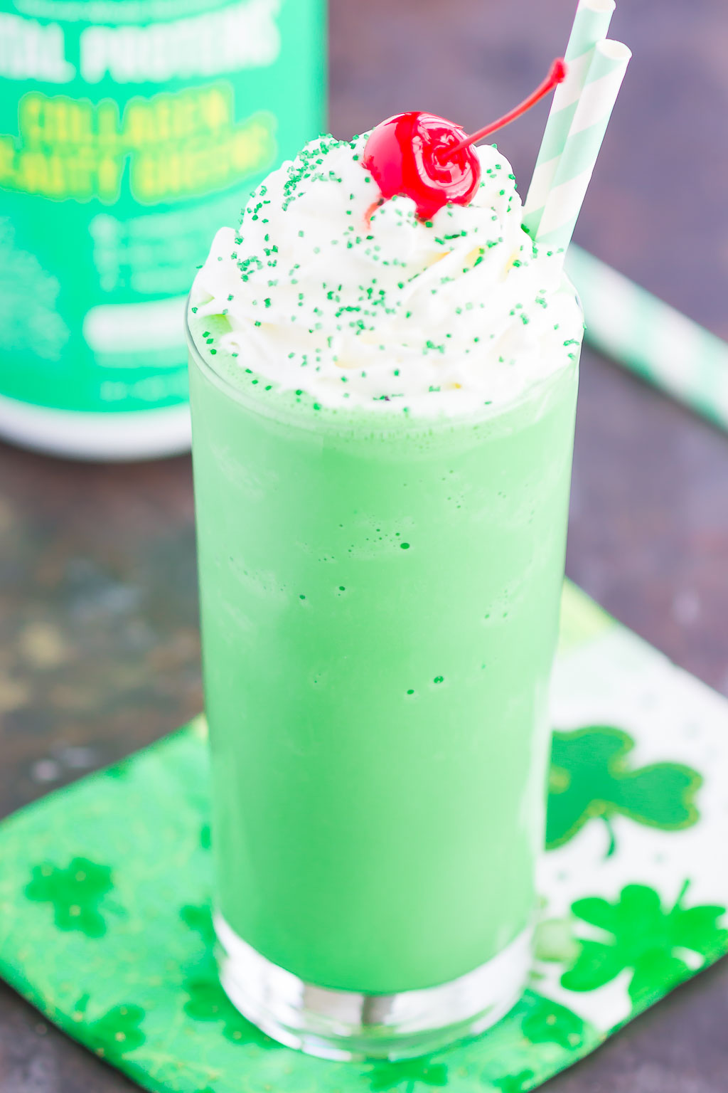 A homemade Shamrock Shake, garnished with whipped cream and a cherry. 