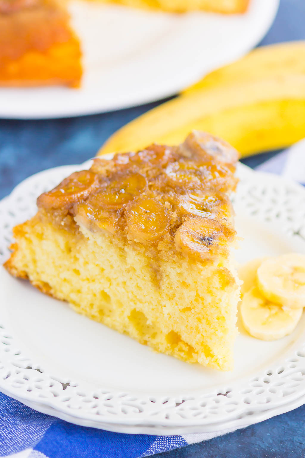 slice of banana upside down cake on a white plate 