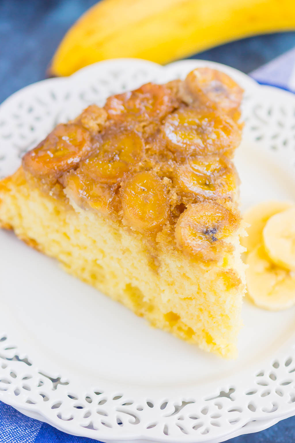 slice of moist banana cake on a white plate 