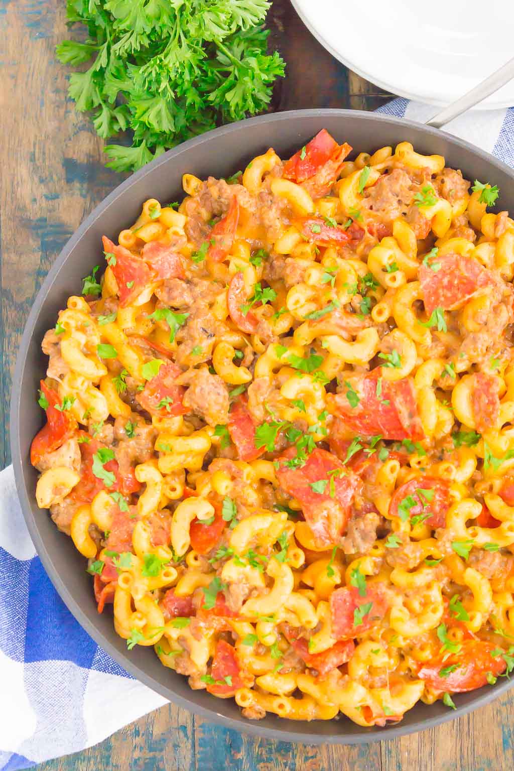 This Pepperoni Pizza Hamburger Helper is a simple, one pan dish that's ready in just 30 minutes. Better than the boxed kind, this cheesy pasta combines the classic flavors of pepperoni pizza that'll be a hit at the dinner table for years to come! #hamburgerhelper #pizzahamburgerhelper #pizzacasserole #pasta #pizzapasta #onepot