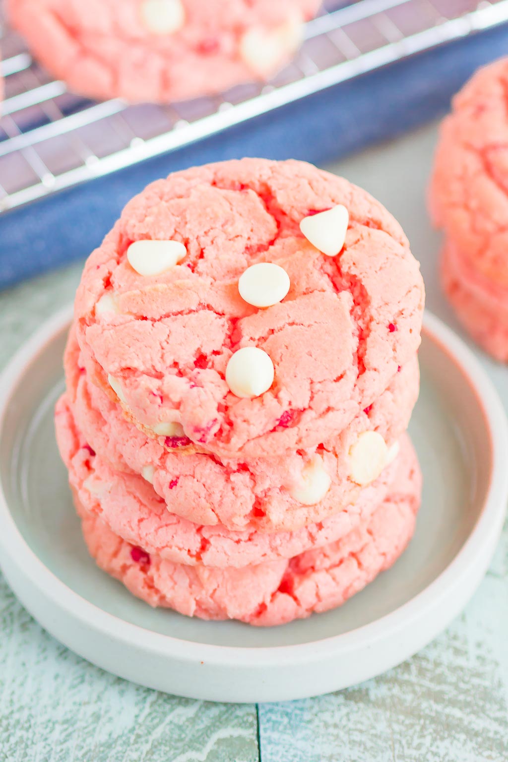 stack of strawberry cake mix cookies on white plate
