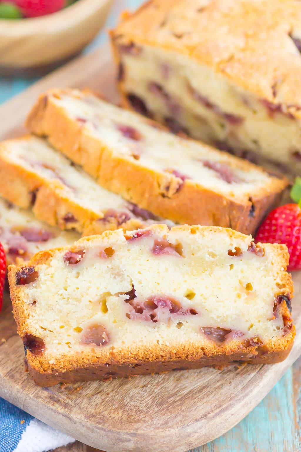 Strawberry Pound Cake is a simple, one bowl recipe that's bursting with flavor. Fresh strawberries are sprinkled throughout this soft and dense pound cake, resulting in the most delicious taste. Perfect to serve alongside your morning coffee or as a tasty dessert! #poundcake #strawberrypoundcake