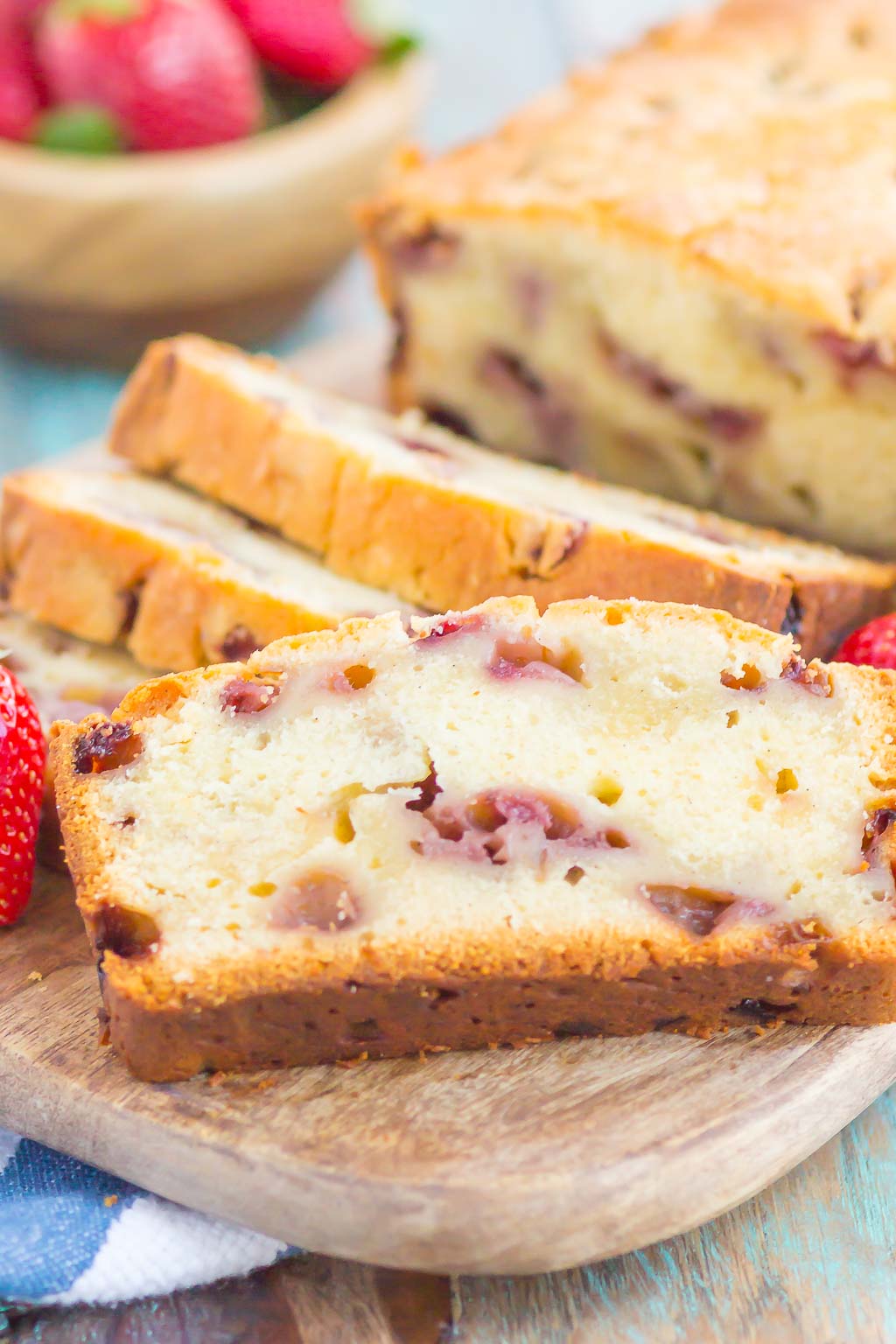 Strawberry Pound Cake is a simple, one bowl recipe that's bursting with flavor. Fresh strawberries are sprinkled throughout this soft and dense pound cake, resulting in the most delicious taste. Perfect to serve alongside your morning coffee or as a tasty dessert! #poundcake #strawberrypoundcake