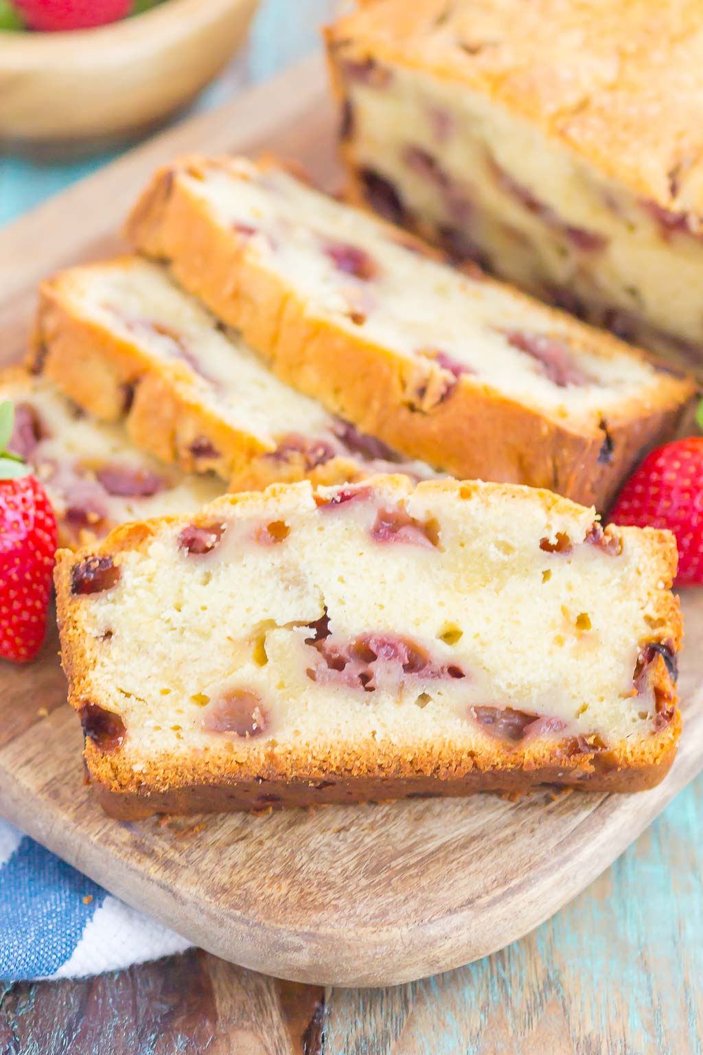 Strawberry Pound Cake is a simple, one bowl recipe that's bursting with flavor. Fresh strawberries are sprinkled throughout this soft and dense pound cake, resulting in the most delicious taste. Perfect to serve alongside your morning coffee or as a tasty dessert! #poundcake #strawberrypoundcake