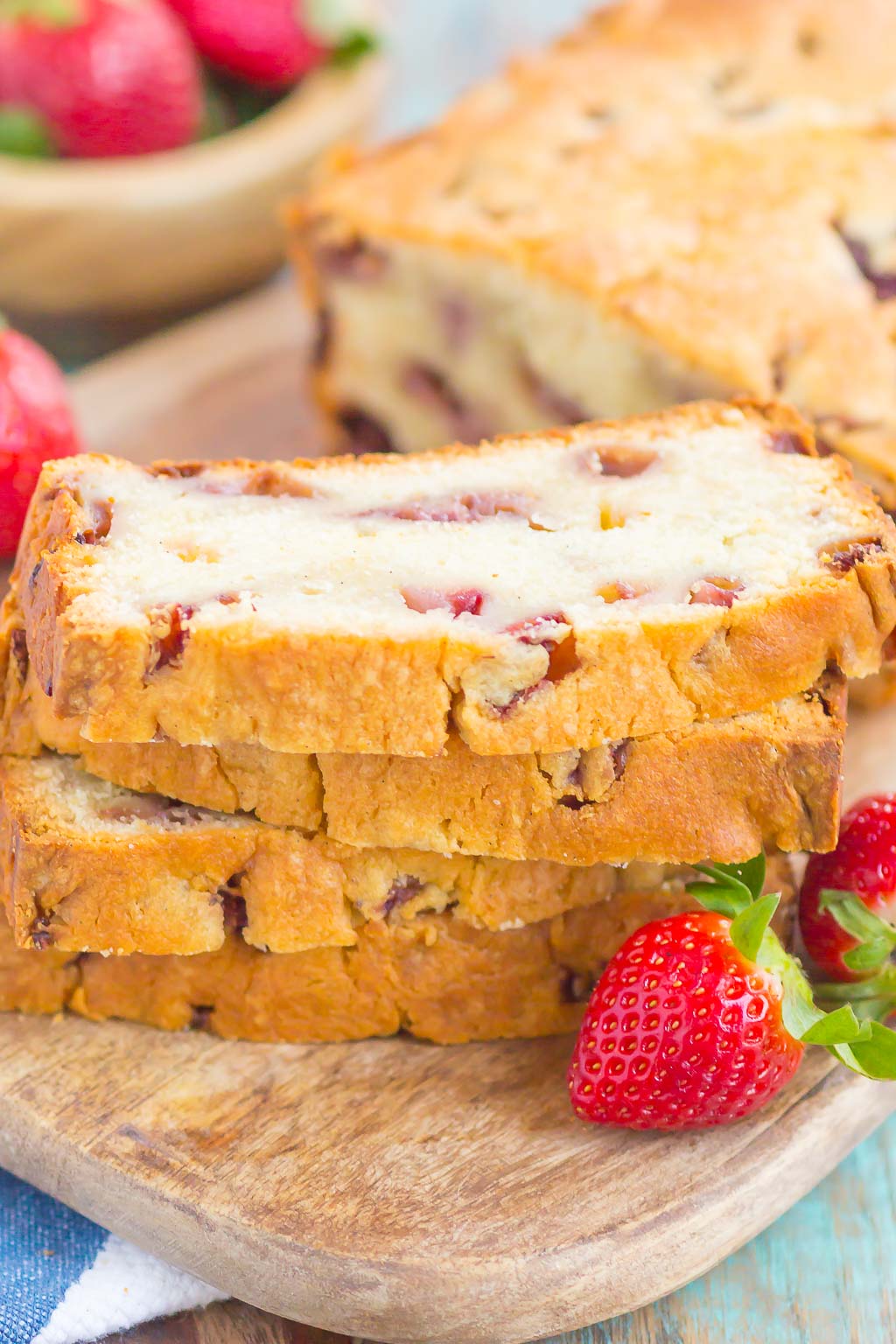 Strawberry Pound Cake is a simple, one bowl recipe that's bursting with flavor. Fresh strawberries are sprinkled throughout this soft and dense pound cake, resulting in the most delicious taste. Perfect to serve alongside your morning coffee or as a tasty dessert! #poundcake #strawberrypoundcake
