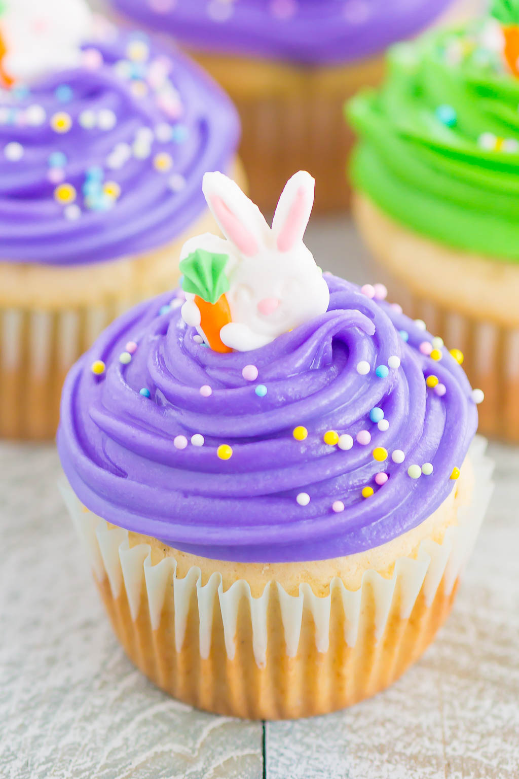an Easter bunny cupcake topped with bright purple frosting 