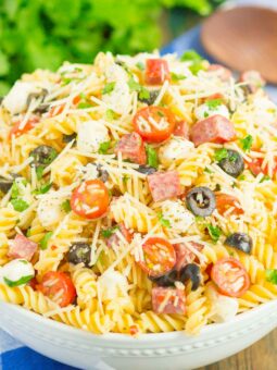 Easy Italian Pasta Salad is fast, fresh, and loaded with flavor. This zesty salad is packed with classic favorites, like salami, mozzarella pearls, black olives, cherry tomatoes and then tossed in a simple Italian dressing. Easy to make and ready in less than 30 minutes, this salad is perfect to serve for those summer parties and get-togethers!
