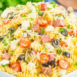 Easy Italian Pasta Salad is fast, fresh, and loaded with flavor. This zesty salad is packed with classic favorites, like salami, mozzarella pearls, black olives, cherry tomatoes and then tossed in a simple Italian dressing. Easy to make and ready in less than 30 minutes, this salad is perfect to serve for those summer parties and get-togethers!