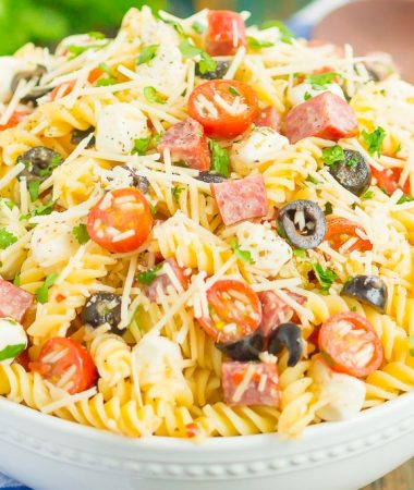 Easy Italian Pasta Salad is fast, fresh, and loaded with flavor. This zesty salad is packed with classic favorites, like salami, mozzarella pearls, black olives, cherry tomatoes and then tossed in a simple Italian dressing. Easy to make and ready in less than 30 minutes, this salad is perfect to serve for those summer parties and get-togethers!