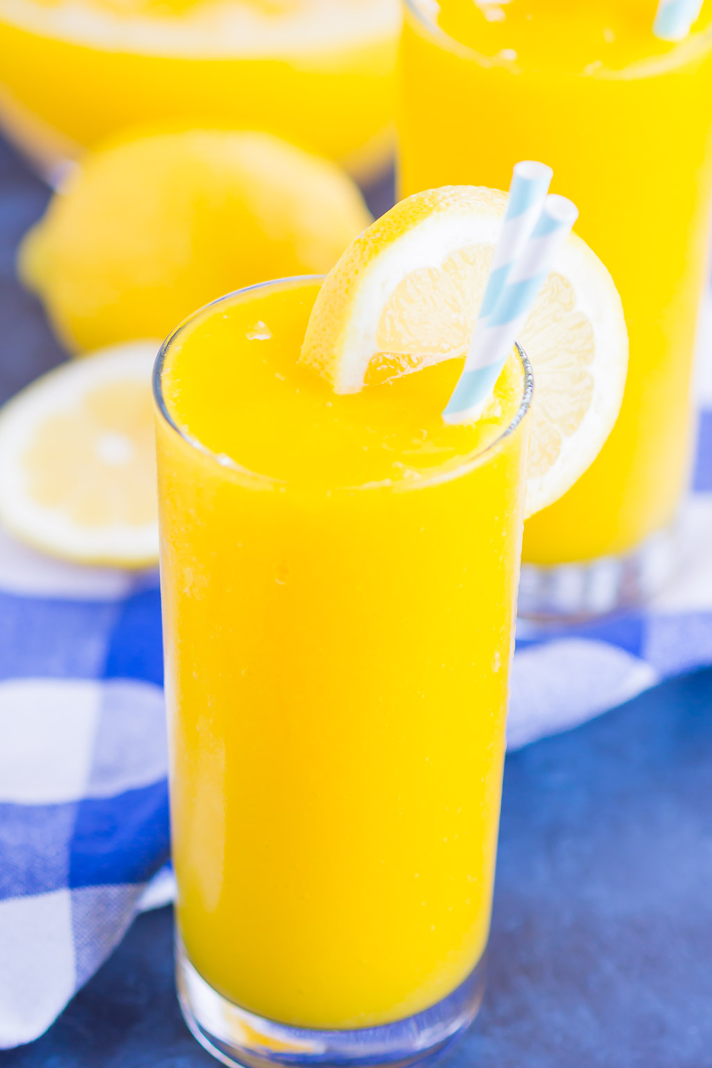 Frozen Mango Lemonade is a delicious way to beat the summer heat. With just four ingredients and ready in less than 5 minutes, you'll love the cool and creamy flavor of sweet mango and tart lemons! #lemonade #frozenlemonade #mangolemonade