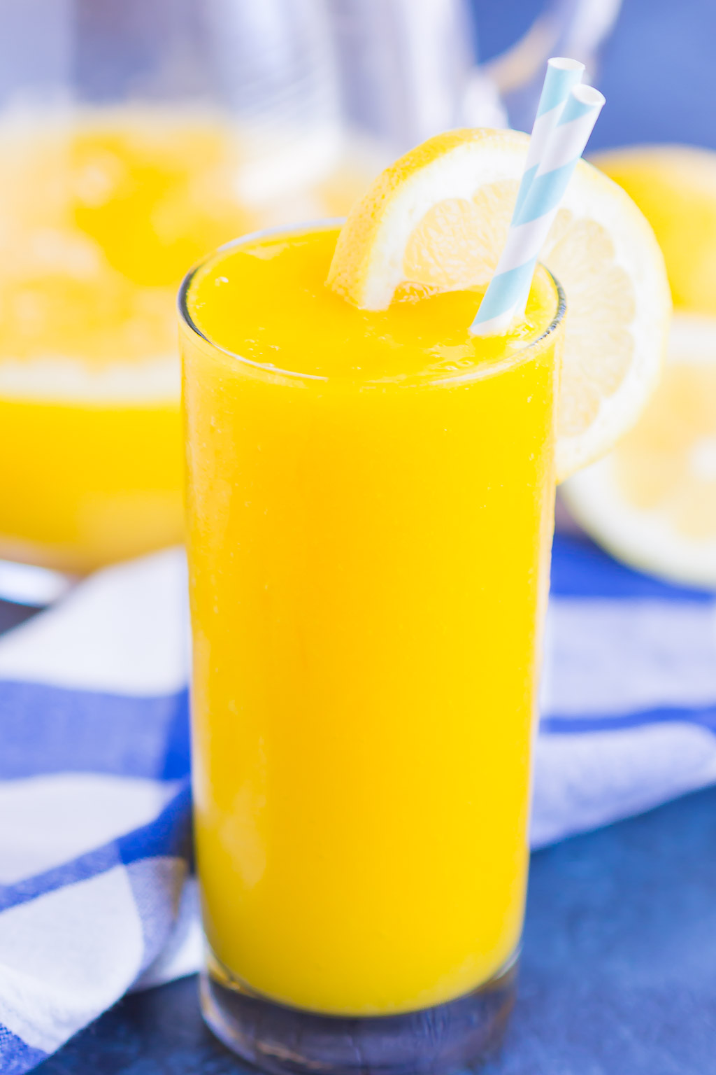 Frozen Mango Lemonade is a delicious way to beat the summer heat. With just four ingredients and ready in less than 5 minutes, you'll love the cool and creamy flavor of sweet mango and tart lemons! #lemonade #frozenlemonade #mangolemonade