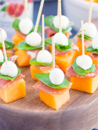 Prosciutto Melon Bites are a simple, sweet and salty appetizer that's perfect for any time. Salty prosciutto and sweet melon are paired with fresh mozzarella and basil to create a match made in food heaven. Easy to make and ready in no time, everyone will love these tasty bites!