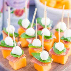 Prosciutto Melon Bites are a simple, sweet and salty appetizer that's perfect for any time. Salty prosciutto and sweet melon are paired with fresh mozzarella and basil to create a match made in food heaven. Easy to make and ready in no time, everyone will love these tasty bites!