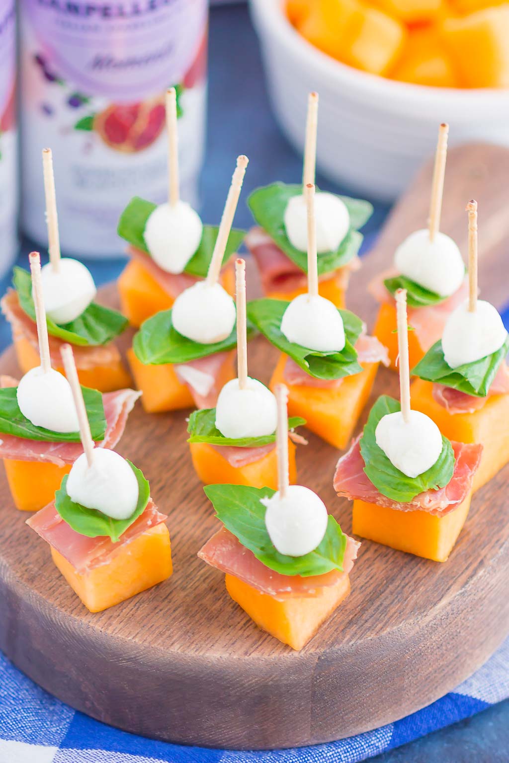 Prosciutto Melon Bites are a simple, sweet and salty appetizer that's perfect for any time. Salty prosciutto and sweet melon are paired with fresh mozzarella and basil to create a match made in food heaven. Easy to make and ready in no time, everyone will love these tasty bites! #prosciuttobites #melonbites #prosciuttomelon #prosciuttoappetizer