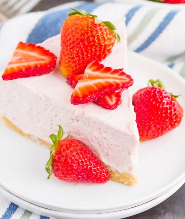 No Bake Strawberry Cheesecake is a simple dessert that's perfect for summer. A golden cookie crust is topped with a creamy strawberry cheesecake filling and then chilled to perfection. Easy to make and with no oven required, this decadent cake makes the most delicious treat!