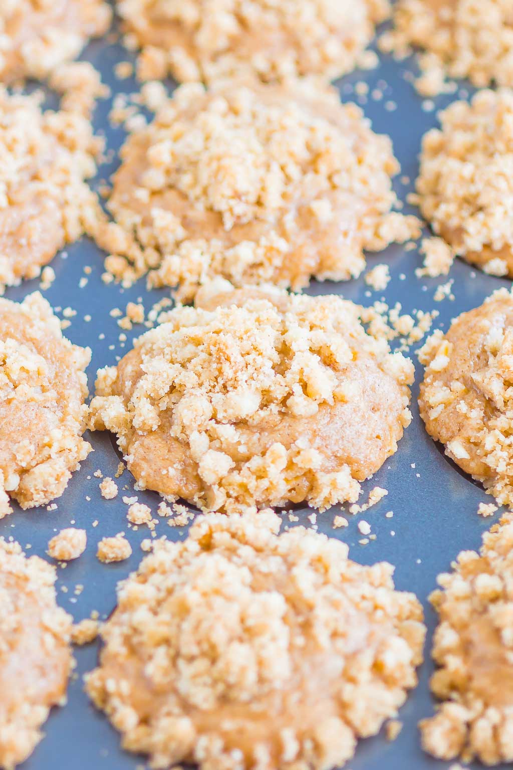 apple cinnamon muffins in muffin tin 