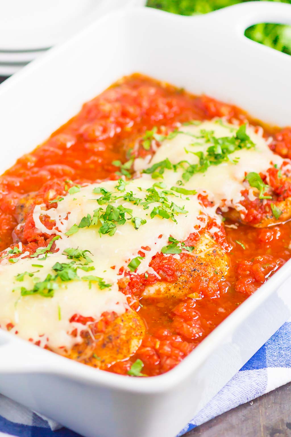 three baked salsa chicken breasts in baking dish