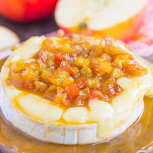 Caramel Apple Baked Brie is an easy appetizer that's ready in just 10 minutes. Fresh apples are sautéed in a buttery brown sugar mixture, drizzled with caramel, and then added to the melty brie. Perfect to serve with pita chips or apple slices, this gooey cheese is guaranteed to be a hit all year long! #brie #bakedbrie #caramel #apples #caramelapple #appetizer #brierecipe #fall recipe #fallappetizer #recipe