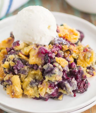 This Easy Blueberry Dump Cake is a delicious, three ingredient dessert that tastes just like your favorite cobbler. Simply dump everything in a pan, bake, and then get ready to wow your tastebuds. Perfect when served warm with a big scoop of vanilla ice cream!
