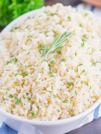 Garlic Herb Rice is a simple side dish that's ready in just 20 minutes. A mixture of fresh herbs, garlic and butter make this easy dish loaded with flavor and perfect to accompany any meal!