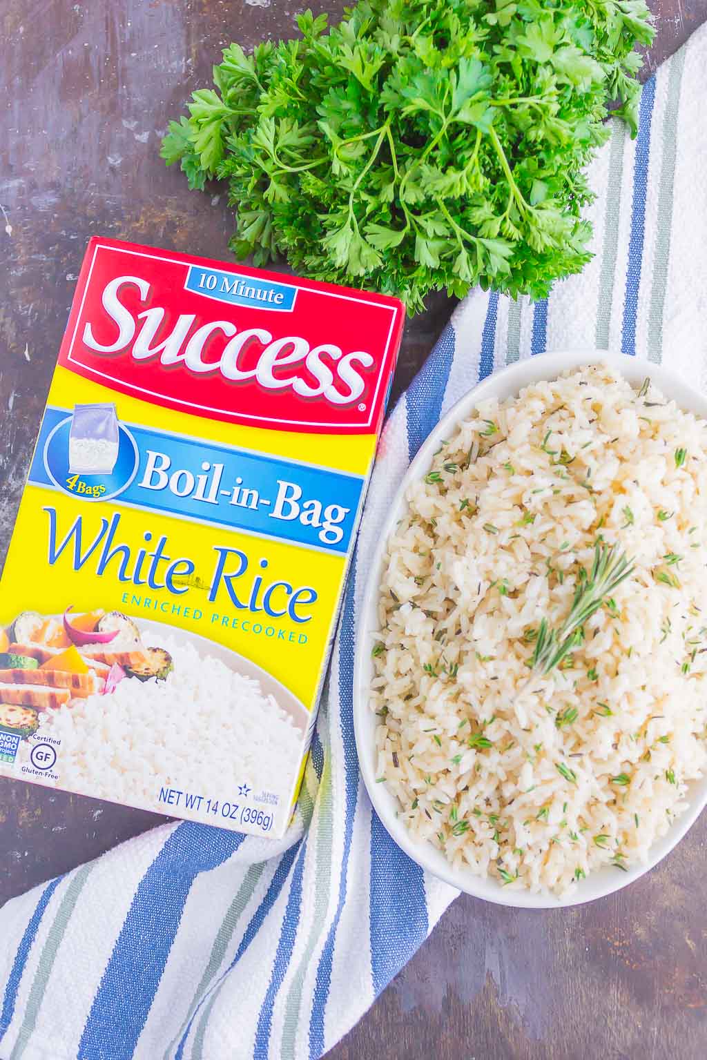 Garlic Herb Rice is a simple side dish that's ready in just 20 minutes. A mixture of fresh herbs, garlic and butter make this easy dish loaded with flavor and perfect to accompany any meal! #rice #garlic #garlicrice #butter #butterrice #sidedish #recipe