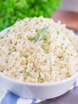 Garlic Herb Rice is a simple side dish that's ready in just 20 minutes. A mixture of fresh herbs, garlic and butter make this easy dish loaded with flavor and perfect to accompany any meal!