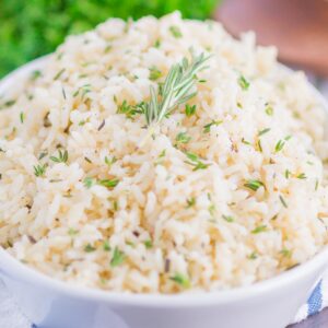 Garlic Herb Rice is a simple side dish that's ready in just 20 minutes. A mixture of fresh herbs, garlic and butter make this easy dish loaded with flavor and perfect to accompany any meal!