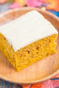 a slice of pumpkin cake with cream cheese frosting