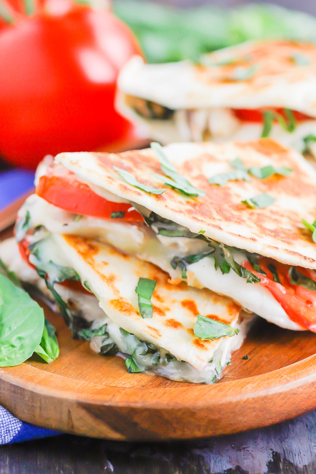 Chicken Caprese Quesadillas are an easy meal that comes together in minutes. With shredded chicken, fresh mozzarella, tomatoes and basil, this dish is kid-friendly and perfect for just about any time! #quesadillas #chicken #chickenquesadilla #caprese #capresequesadilla #chickendinner #dinner #recipe