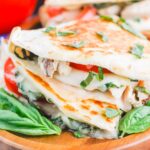 Chicken Caprese Quesadillas are an easy meal that comes together in minutes. With shredded chicken, fresh mozzarella, tomatoes and basil, this dish is kid-friendly and perfect for just about any time! #quesadillas #chicken #chickenquesadilla #caprese #capresequesadilla #chickendinner #dinner #recipe