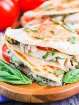 Chicken Caprese Quesadillas are an easy meal that comes together in minutes. With shredded chicken, fresh mozzarella, tomatoes and basil, this dish is kid-friendly and perfect for just about any time! #quesadillas #chicken #chickenquesadilla #caprese #capresequesadilla #chickendinner #dinner #recipe
