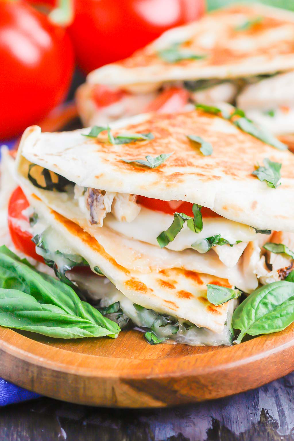 Chicken Caprese Quesadillas are an easy meal that comes together in minutes. With shredded chicken, fresh mozzarella, tomatoes and basil, this dish is kid-friendly and perfect for just about any time! #quesadillas #chicken #chickenquesadilla #caprese #capresequesadilla #chickendinner #dinner #recipe