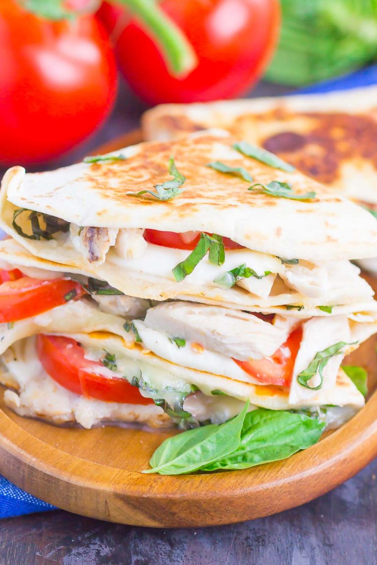 Chicken Caprese Quesadillas with shredded chicken, fresh mozzarella, tomatoes, and basil.