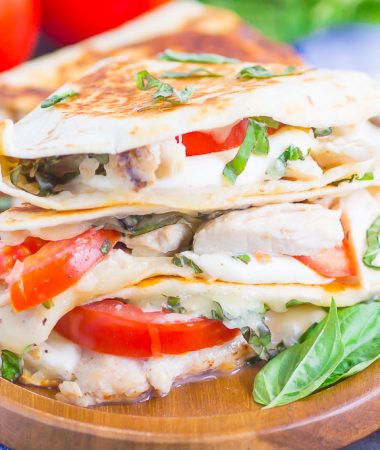 Chicken Caprese Quesadillas are an easy meal that comes together in minutes. With shredded chicken, fresh mozzarella, tomatoes and basil, this dish is kid-friendly and perfect for just about any time! #quesadillas #chicken #chickenquesadilla #caprese #capresequesadilla #chickendinner #dinner #recipe