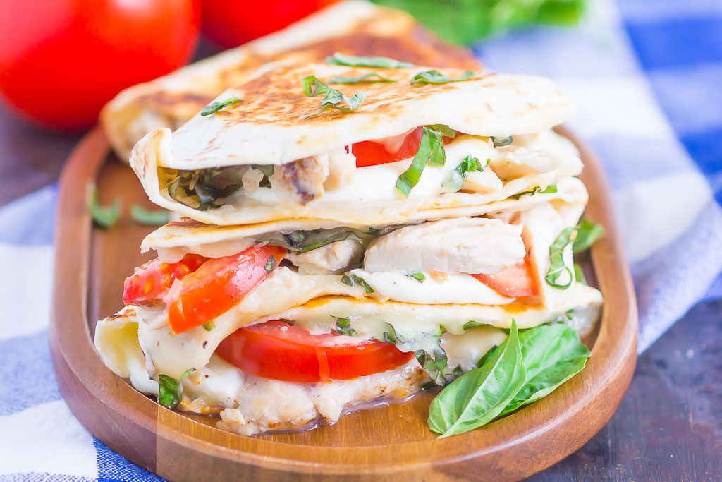 Chicken Caprese Quesadillas are an easy meal that comes together in minutes. With shredded chicken, fresh mozzarella, tomatoes and basil, this dish is kid-friendly and perfect for just about any time! #quesadillas #chicken #chickenquesadilla #caprese #capresequesadilla #chickendinner #dinner #recipe