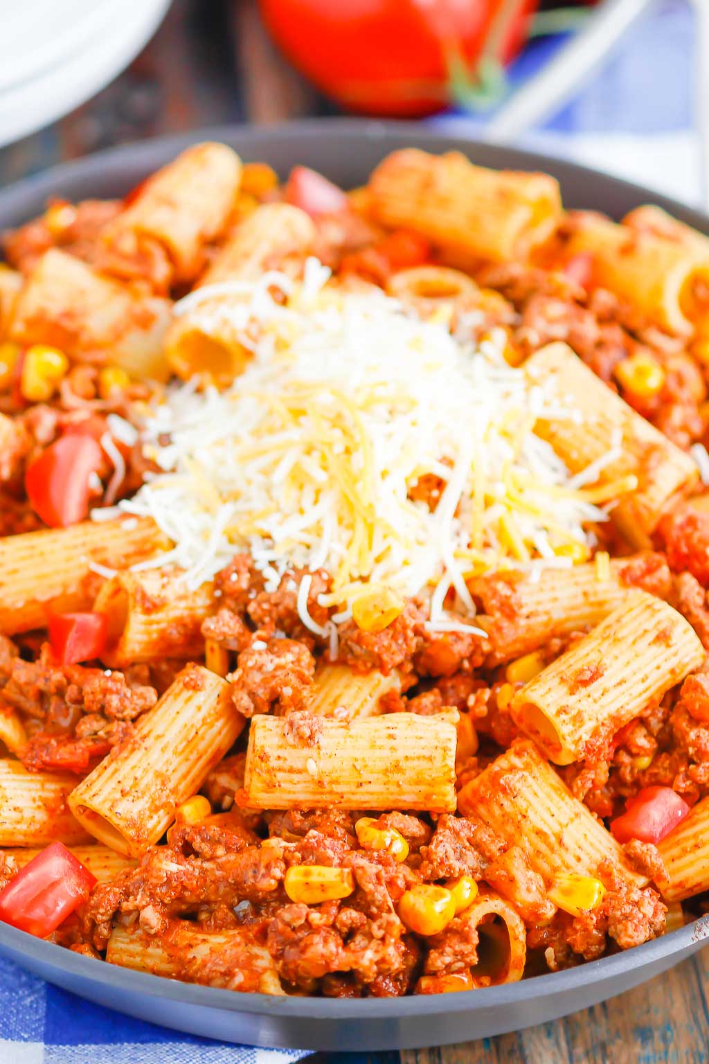 chili pasta garnished with cheese in a large skillet 