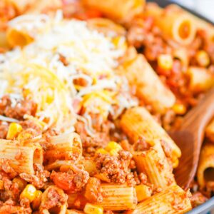 There is no better comfort food than this Chili with Pasta skillet meal. A comforting combination of ground beef, tomatoes, corn, and pasta come together with the perfect homemade chili seasoning to create an all in one meal you’ll love! #chili #chilipasta #chilipastaskillet #skilletdinner #pasta #easydinner #dinner #comfortfood