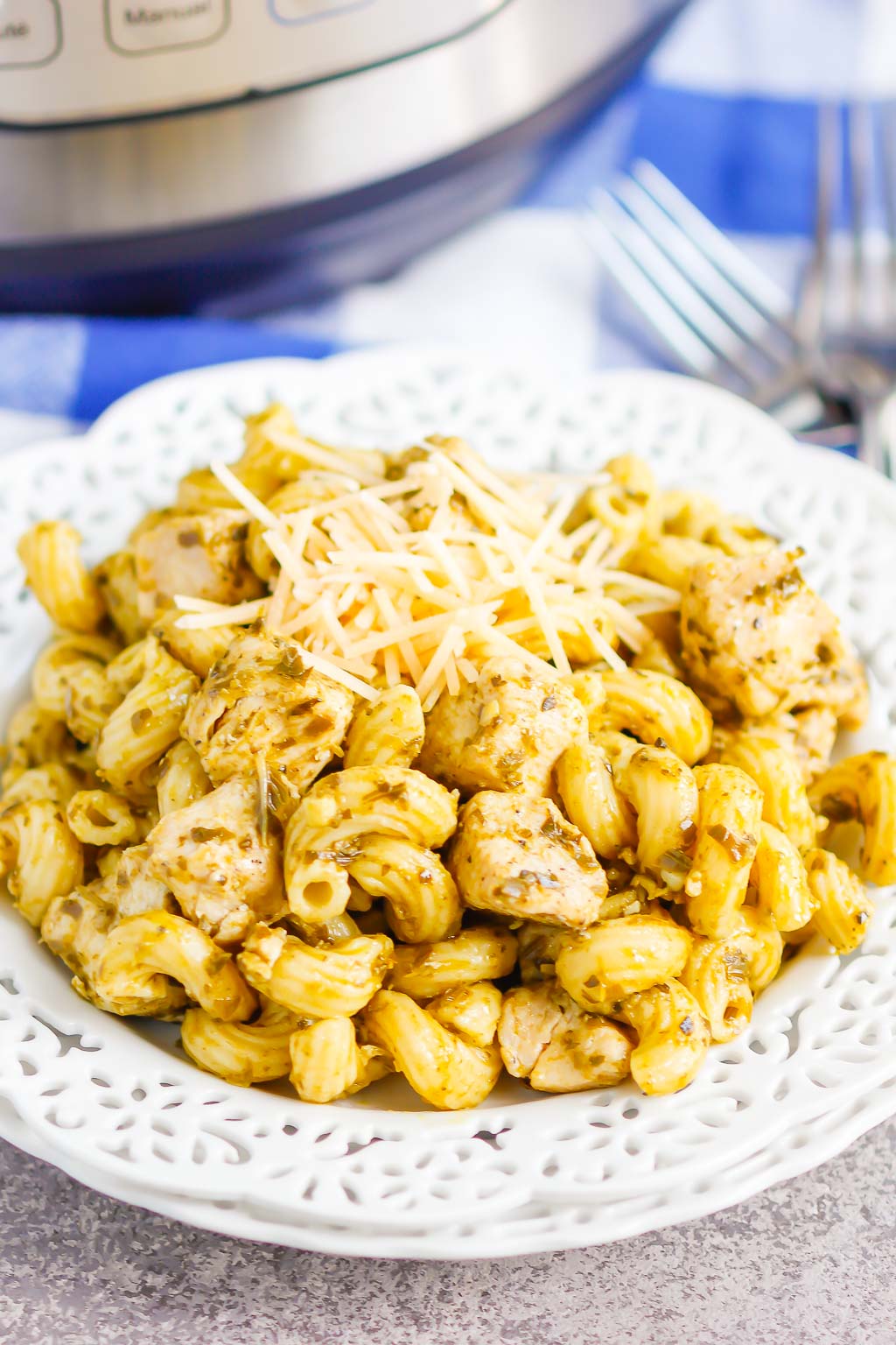 a portion of Instant Pot pesto chicken pasta in a white dish