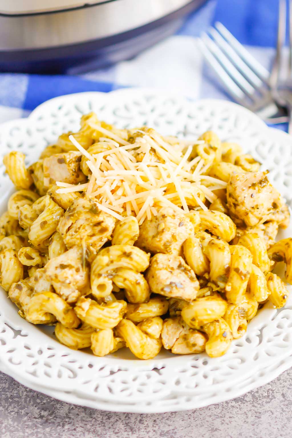 a portion of Instant Pot chicken and pesto pasta in a white dish 