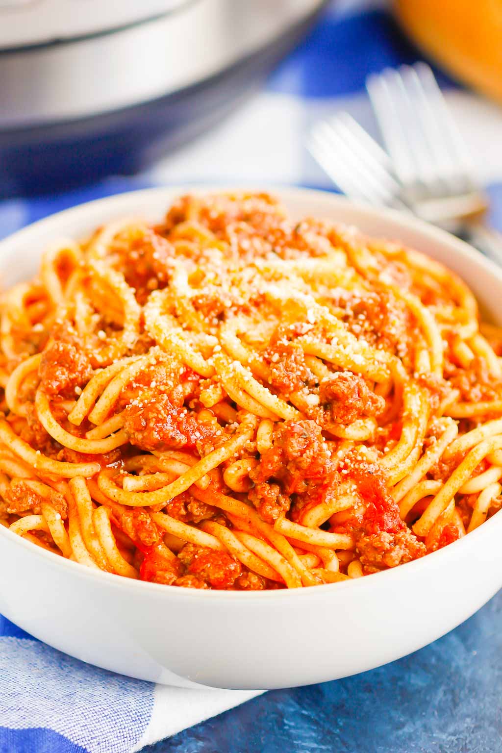 A serving of Instant Pot spaghetti in a large white bowl. 