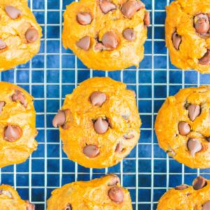Pumpkin Chocolate Chip Cookies are an easy, one bowl recipe that's ready in no time. These cookies bake up soft and cakey, with hints of pumpkin and sweet chocolate. It's the perfect combination for an autumn sweet treat! #cookies #pumpkincookies #pumpkinchocolatechipcookies #pumpkindessert #falldessert #pumpkinrecipe