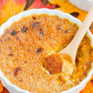 Pumpkin Crème Brûlée features a smooth and creamy custard that's studded with hints of pumpkin and the most delicious caramelized topping. Easy to make, this decadent dessert captures the flavors of fall and is sure to impress everyone! #cremebrulee #pumpkin #pumpkincremebrulee #cremebruleerecipe #falldessert #pumpkindessert #fancydessert