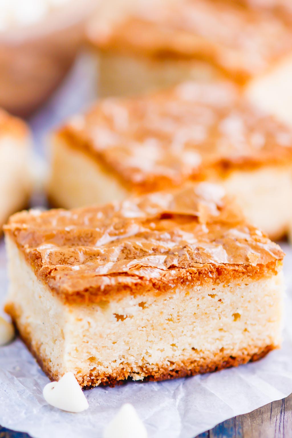 This White Chocolate Blondies Recipe combines the elegance of white chocolate with rich vanilla to bring you a delightfully sweet treat that is ready for the oven in minutes and baked in just half an hour.Â  Serve this recipe with a hot cup of coffee for the perfect treat on a cold day! #blondies #whitechocolate #whitechocolateblondies #blondierecipe #whitechocolatedessert #dessert #easydessert